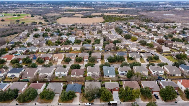 an aerial view of residential building with parking space