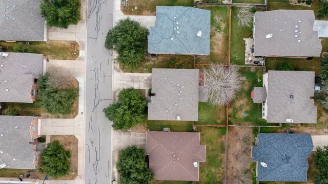 an aerial view of houses with outdoor space