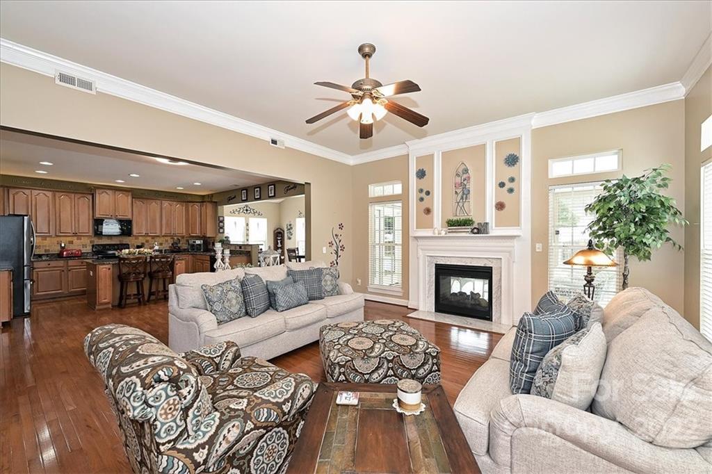 728 Beille Lane Fort Mill, SC 29708 - Photo 15 of 48 a living room with furniture fireplace and a large window