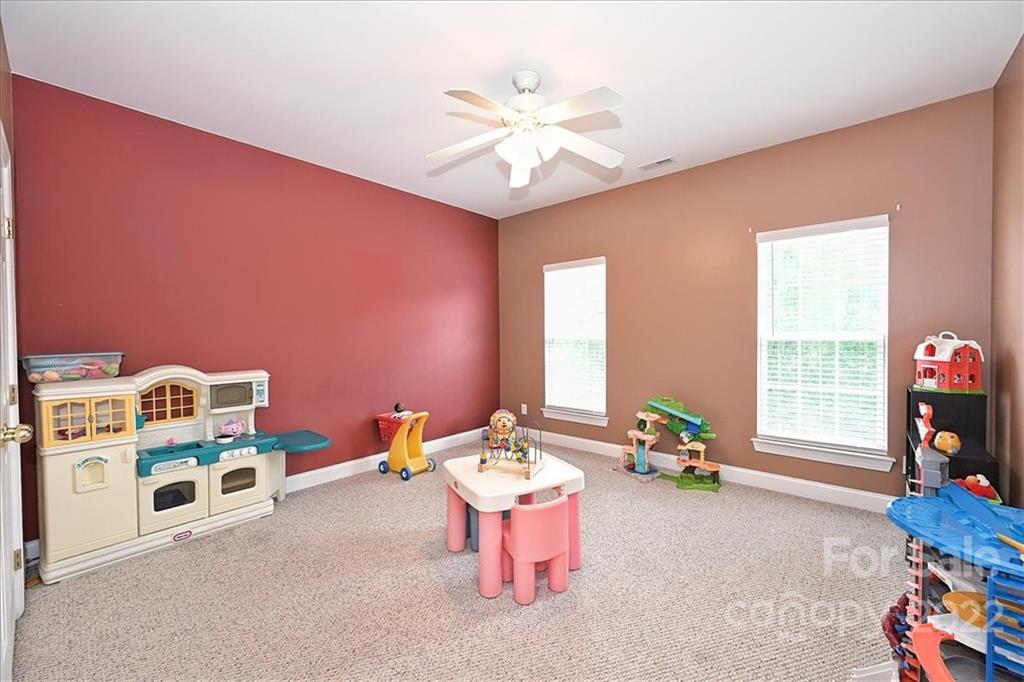 728 Beille Lane Fort Mill, SC 29708 - Photo 36 of 48 a living room with furniture and a flat screen tv