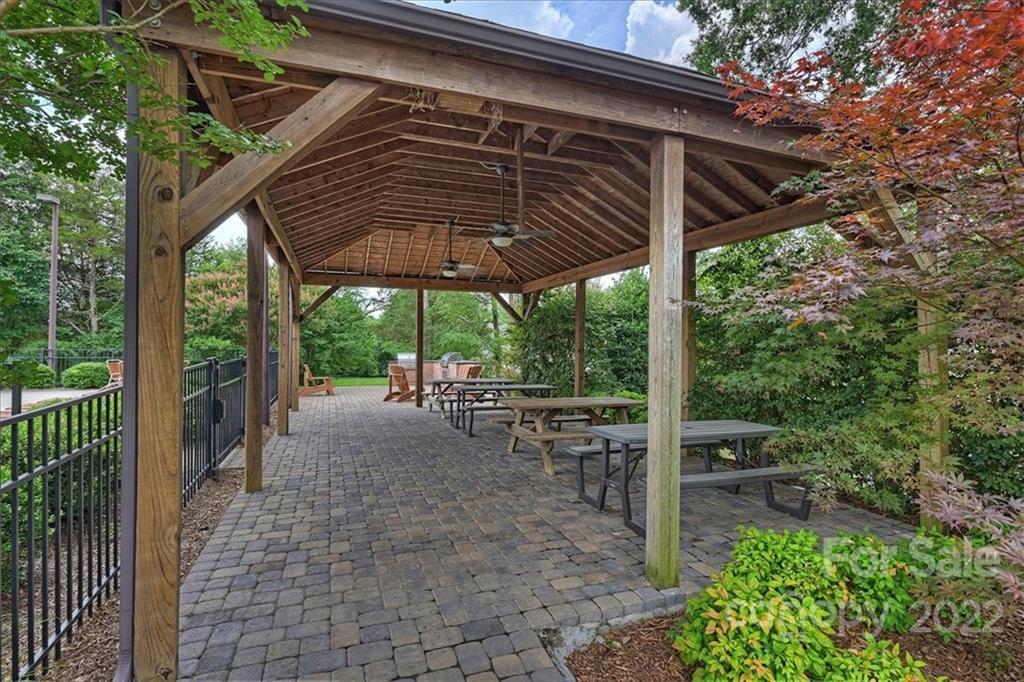 728 Beille Lane Fort Mill, SC 29708 - Photo 48 of 48 a view of a patio with table and chairs under an umbrella