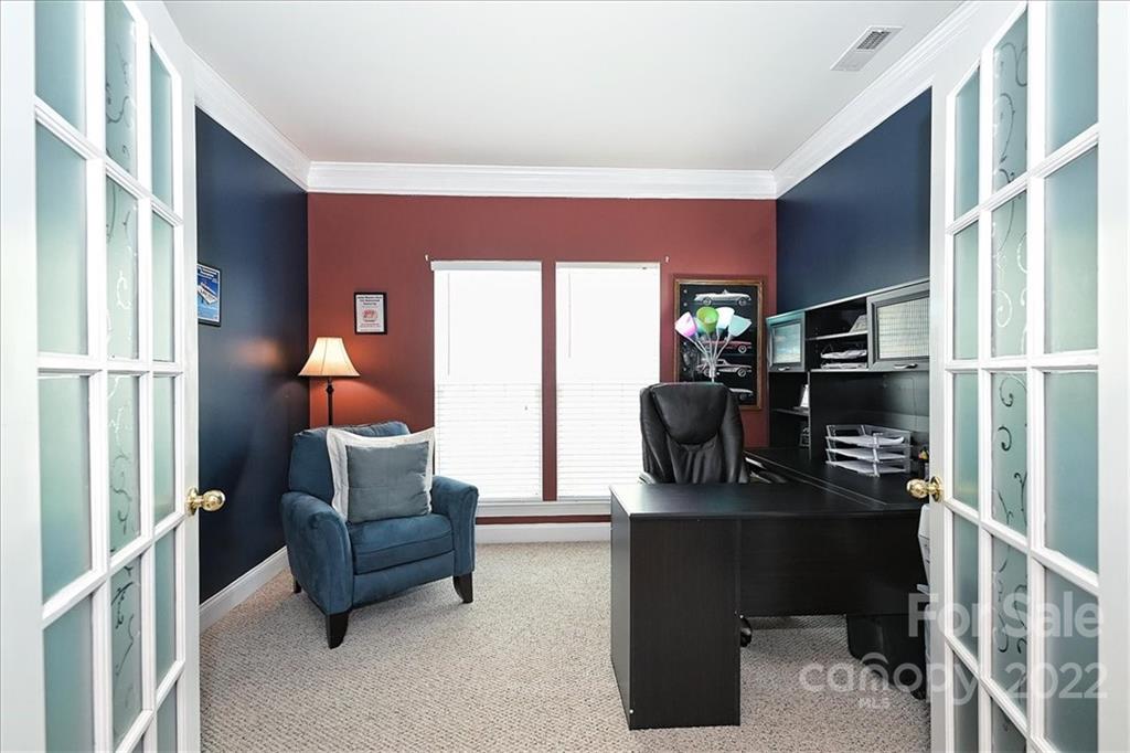728 Beille Lane Fort Mill, SC 29708 - Photo 9 of 48 a living room with furniture a flat screen tv and kitchen view