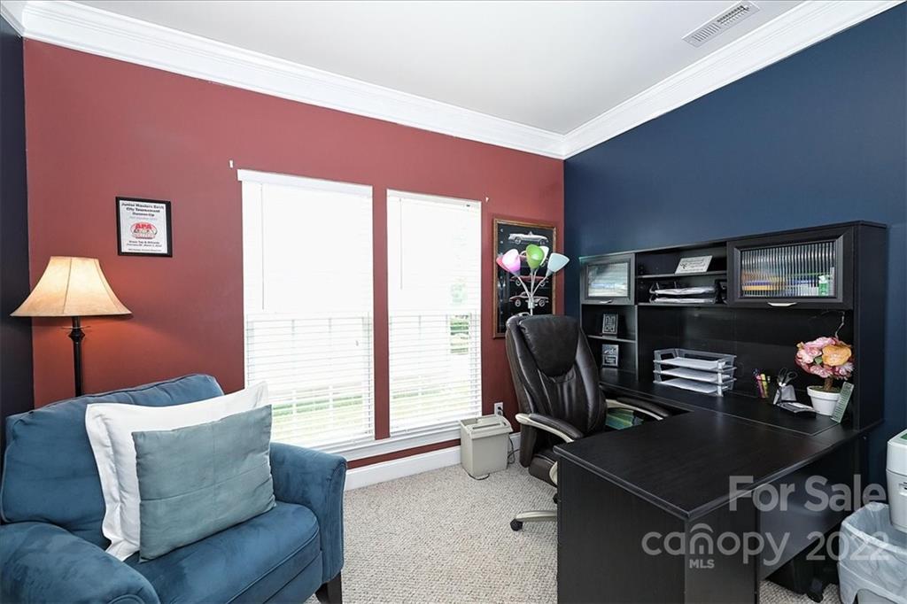 728 Beille Lane Fort Mill, SC 29708 - Photo 10 of 48 a living room with furniture a flat screen tv and a window