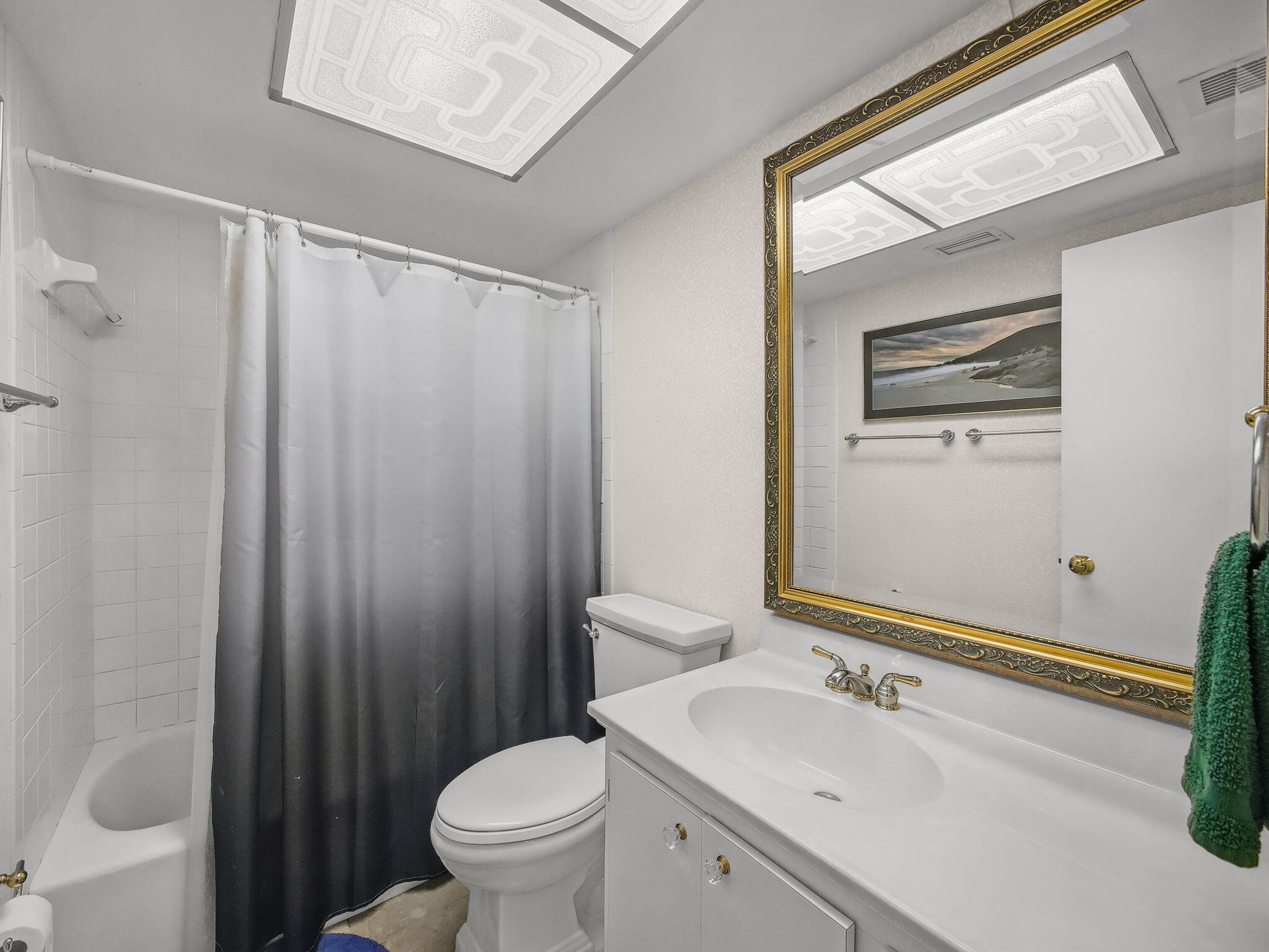 125 South Ocean Avenue, Unit 303 Palm Beach Shores, FL 33404 - Photo 13 of 20 a bathroom with a sink a toilet and shower