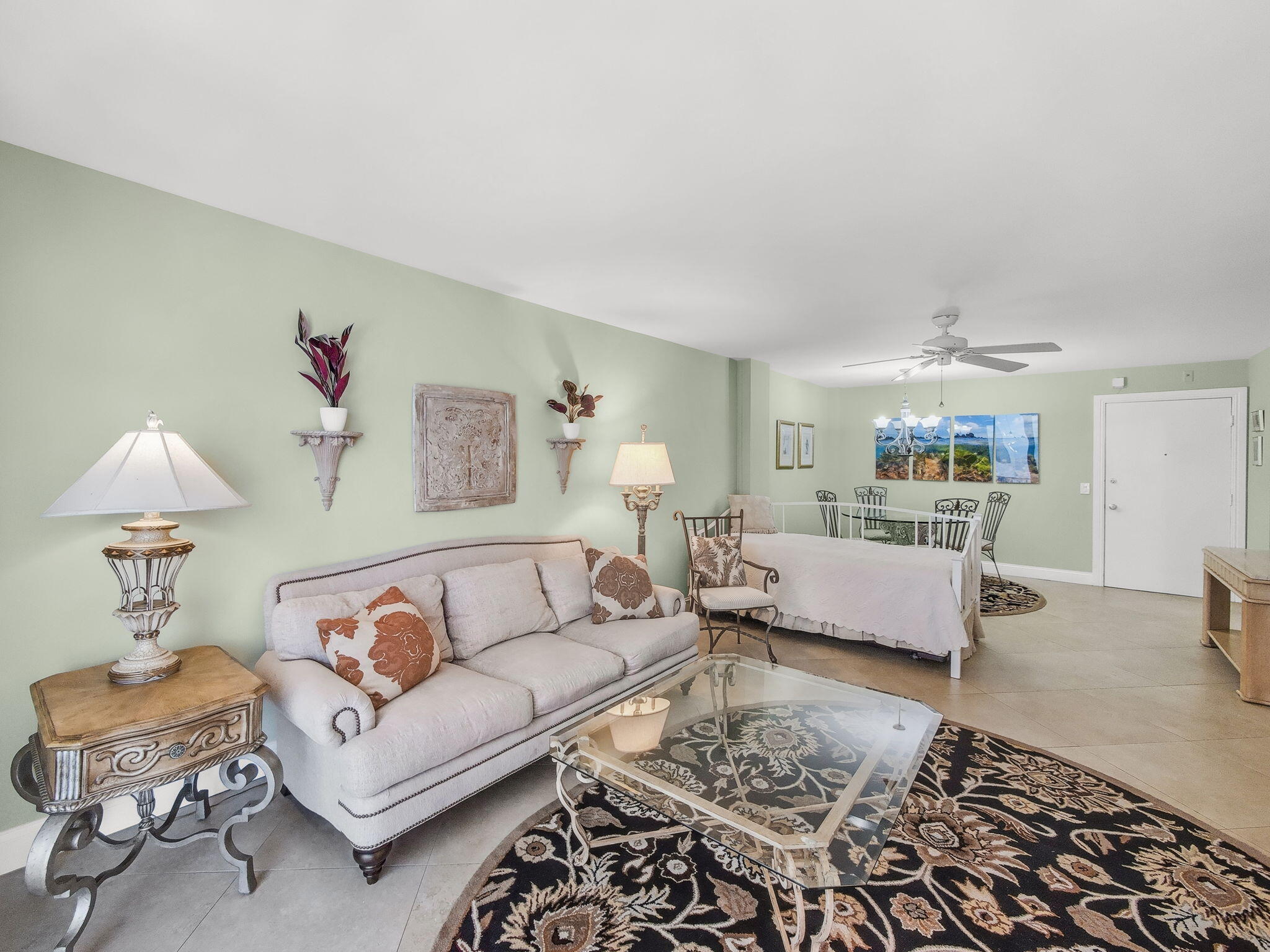 125 South Ocean Avenue, Unit 303 Palm Beach Shores, FL 33404 - Photo 6 of 20 a living room with furniture and a lamp