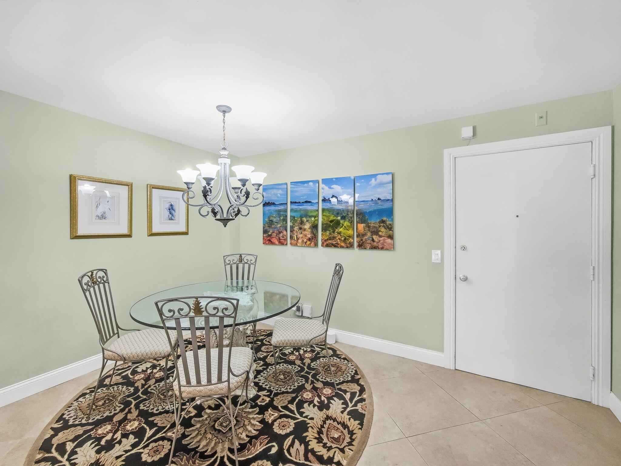 125 South Ocean Avenue, Unit 303 Palm Beach Shores, FL 33404 - Photo 7 of 20 a view of a dining room with furniture