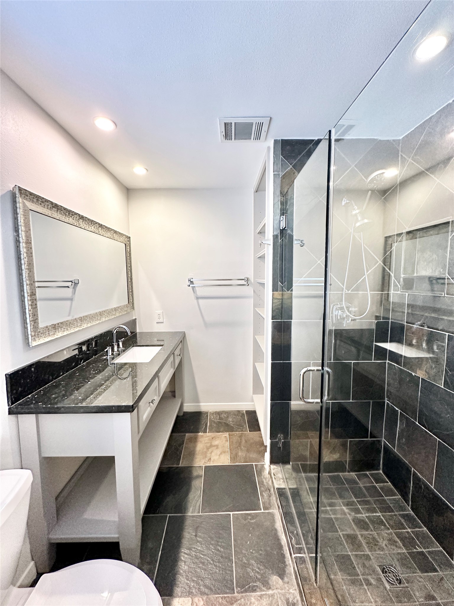 22 Champions Colony West Houston, TX 77069 - Photo 13 of 14 a bathroom with a granite countertop sink a mirror and shower