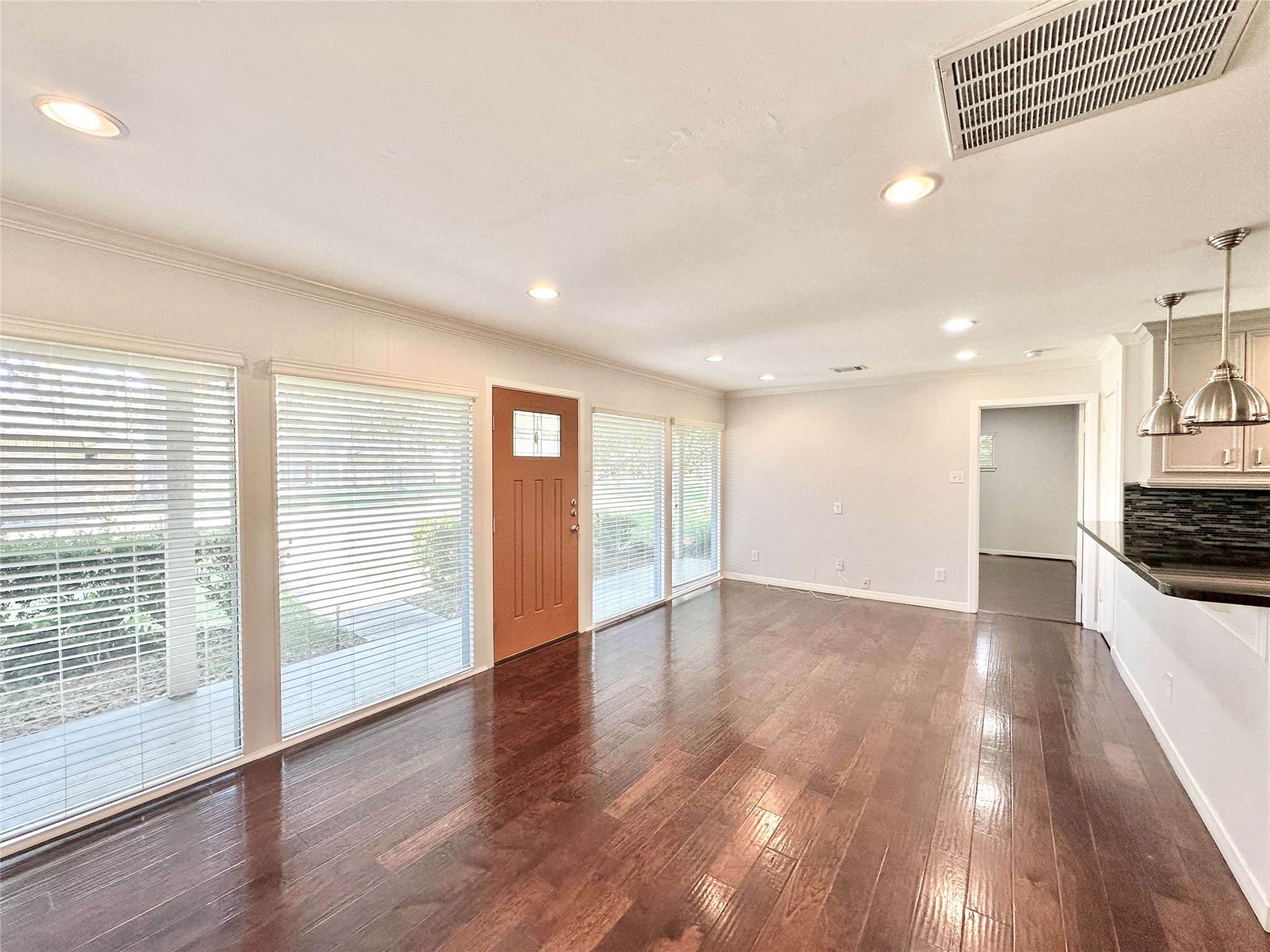 22 Champions Colony West Houston, TX 77069 - Photo 5 of 14 a view of an empty room with wooden floor and a window
