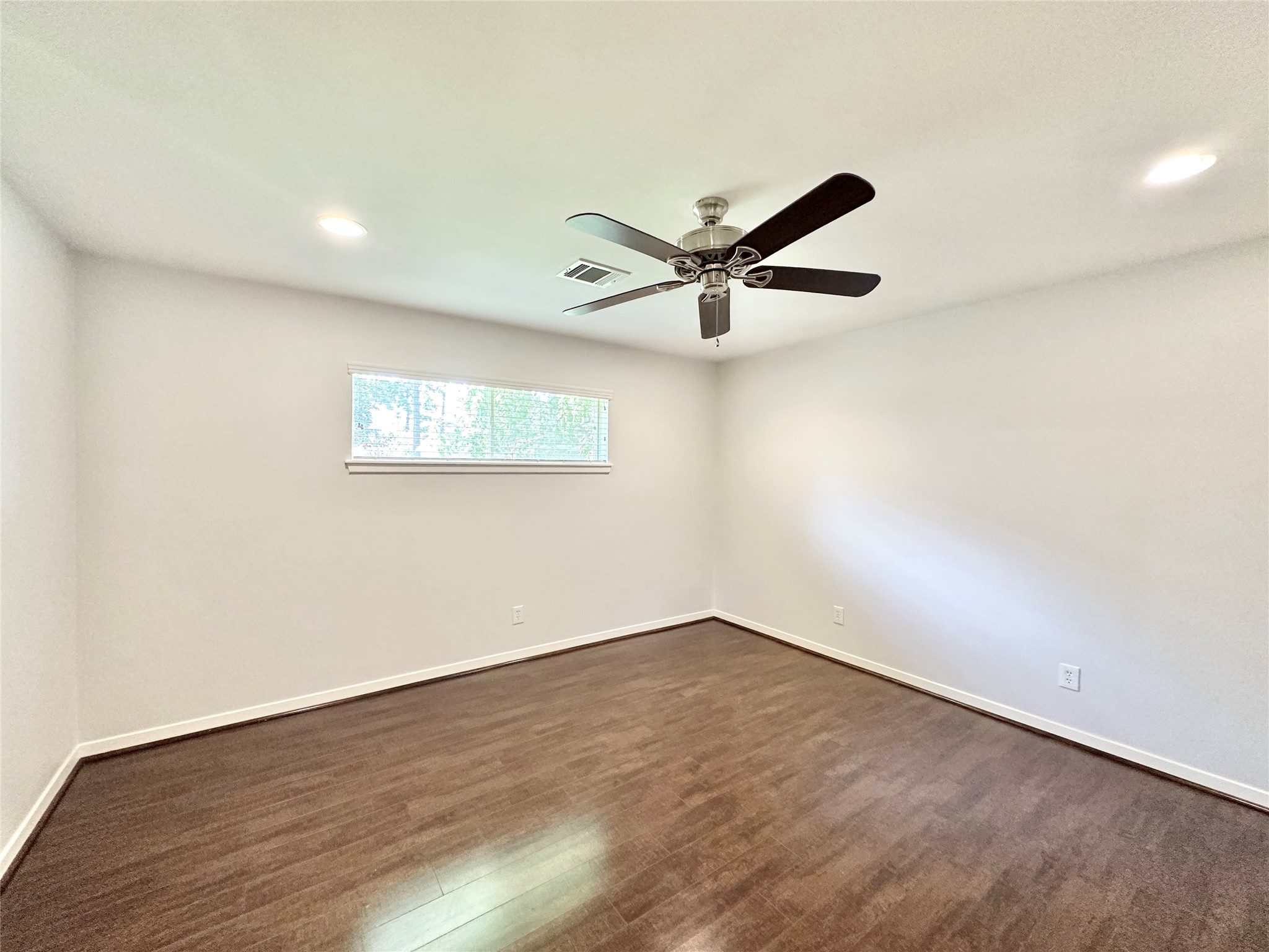 22 Champions Colony West Houston, TX 77069 - Photo 10 of 14 an empty room with wooden floor and windows