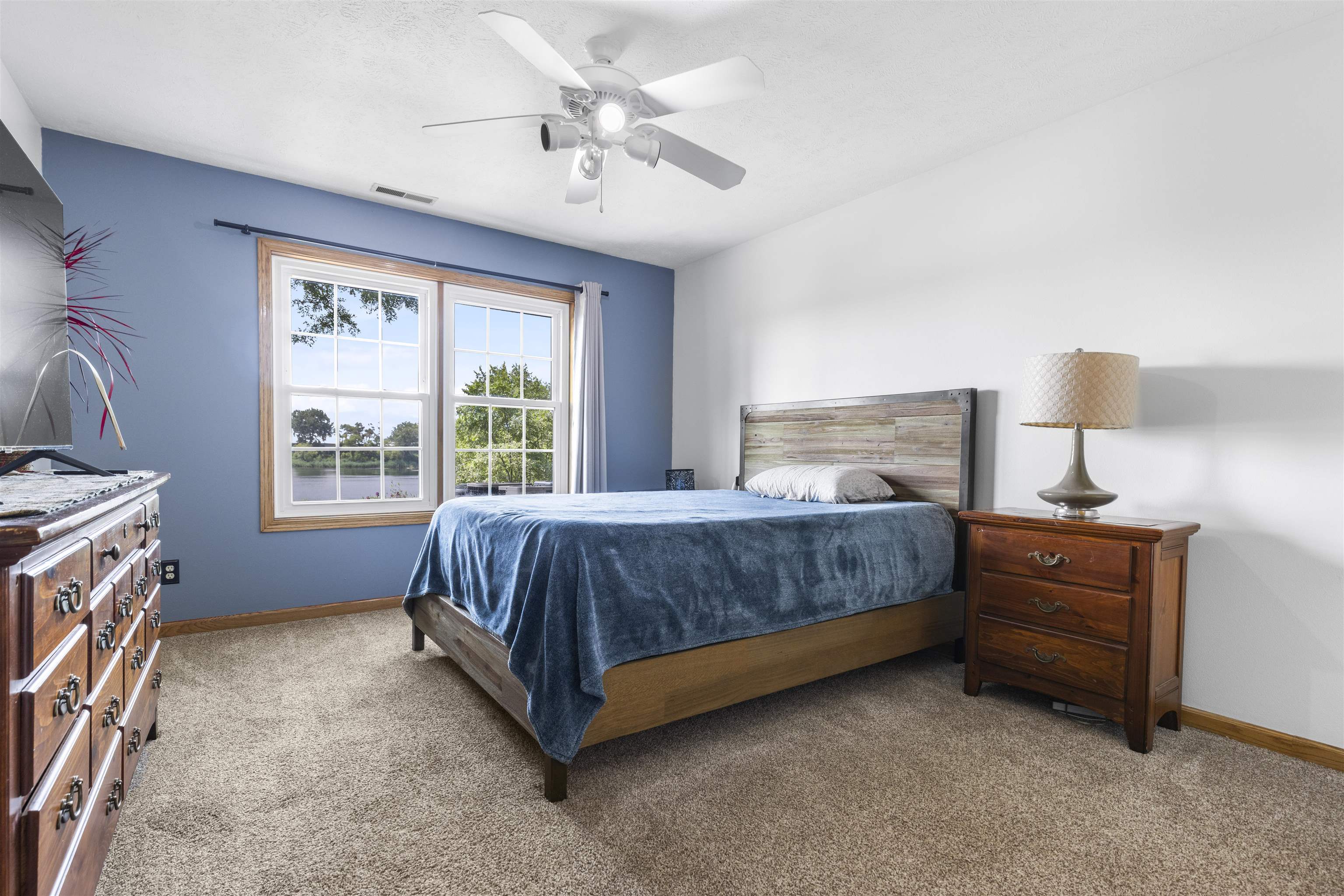 7280 North Alpine Road, Unit 1 Loves Park, IL 61111 - Photo 9 of 14 a bedroom with a bed dresser and a window