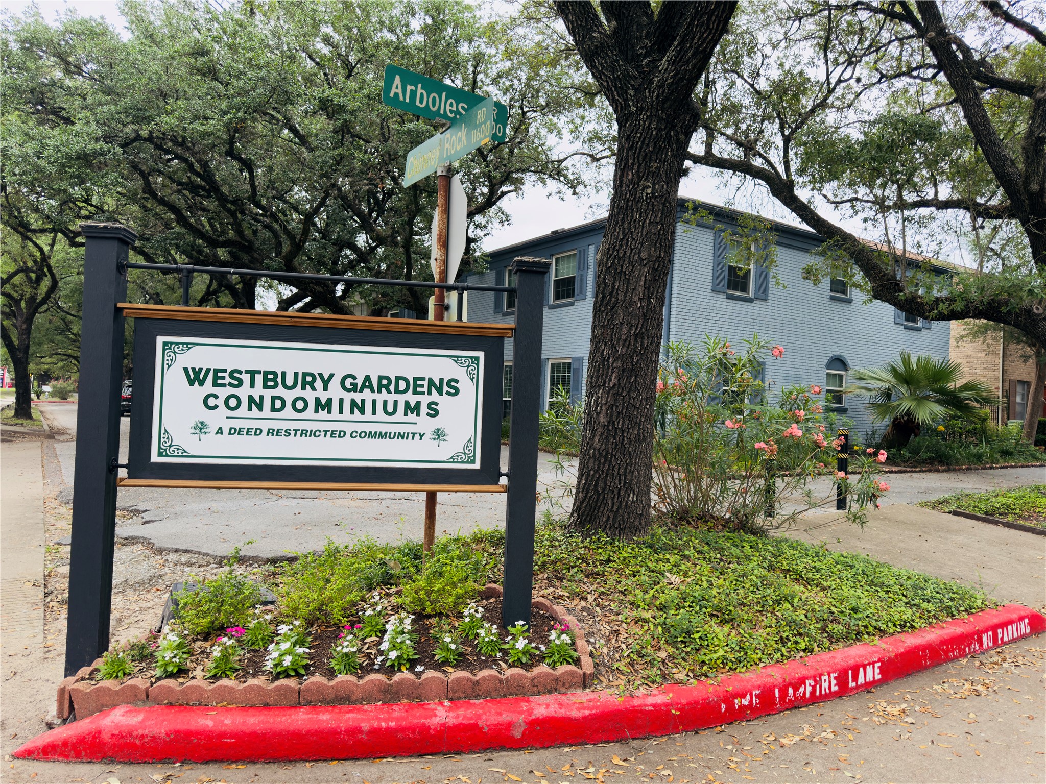 11643 Chimney Rock Road, Unit B Houston, TX 77035 - Photo 7 of 9 a sign on the side of a building