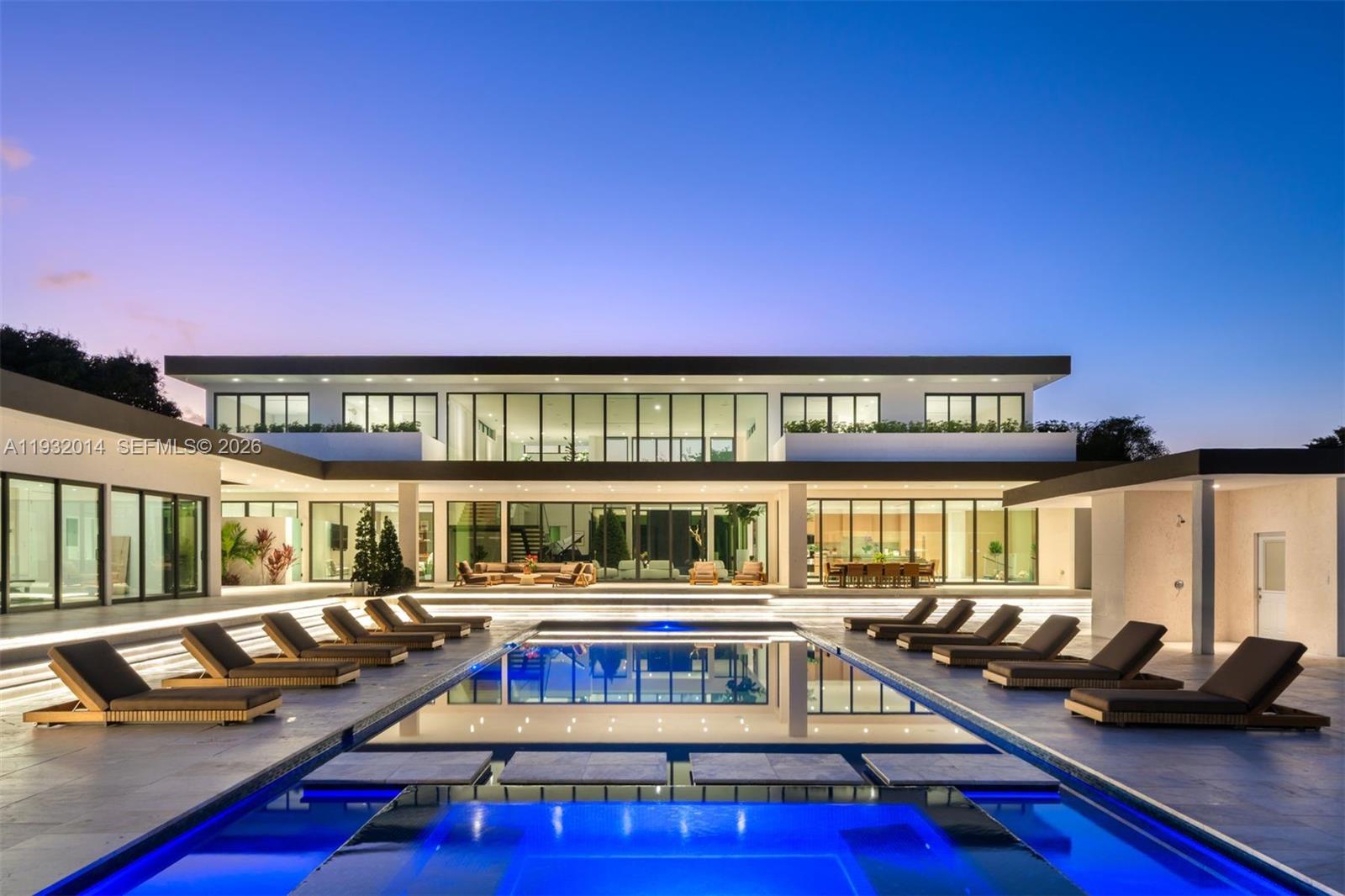 a view of a swimming pool with seating area