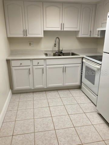 914 Lake Destiny Road, Unit H Altamonte Springs, FL 32714 - Photo 5 of 13 a kitchen with a sink and cabinets