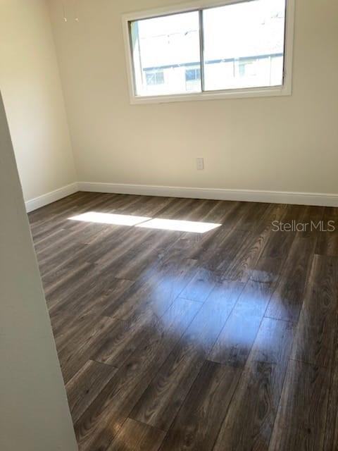 914 Lake Destiny Road, Unit H Altamonte Springs, FL 32714 - Photo 9 of 13 an empty room with wooden floor and windows