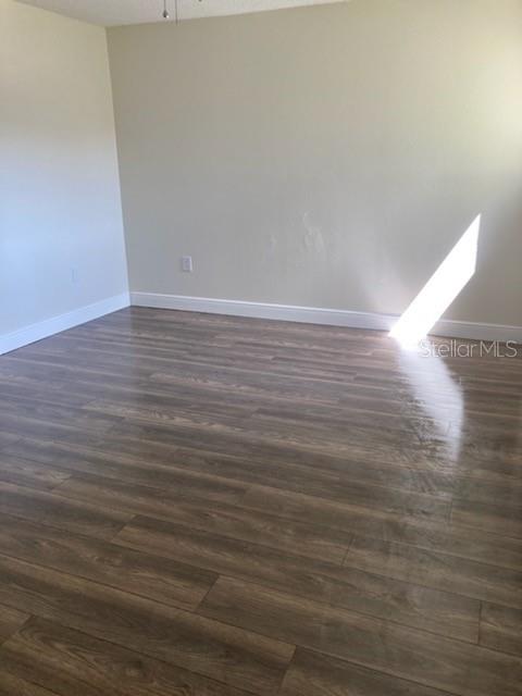914 Lake Destiny Road, Unit H Altamonte Springs, FL 32714 - Photo 10 of 13 a view of room with wooden floor