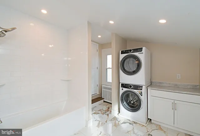 a view of washer and dryer in a utility room