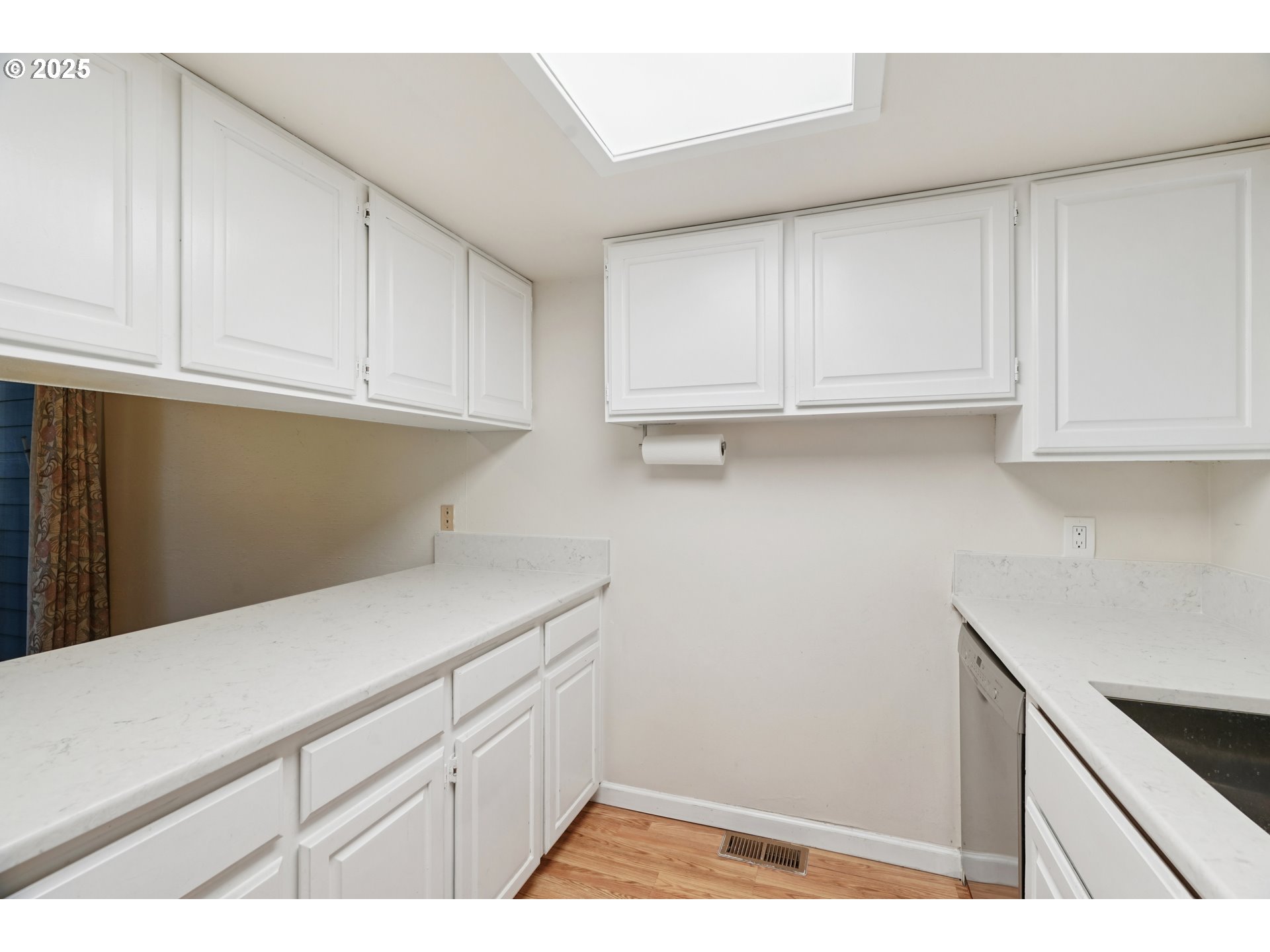 14678 Southwest 106th Avenue Tigard, OR 97224 - Photo 18 of 41 a kitchen with white cabinets