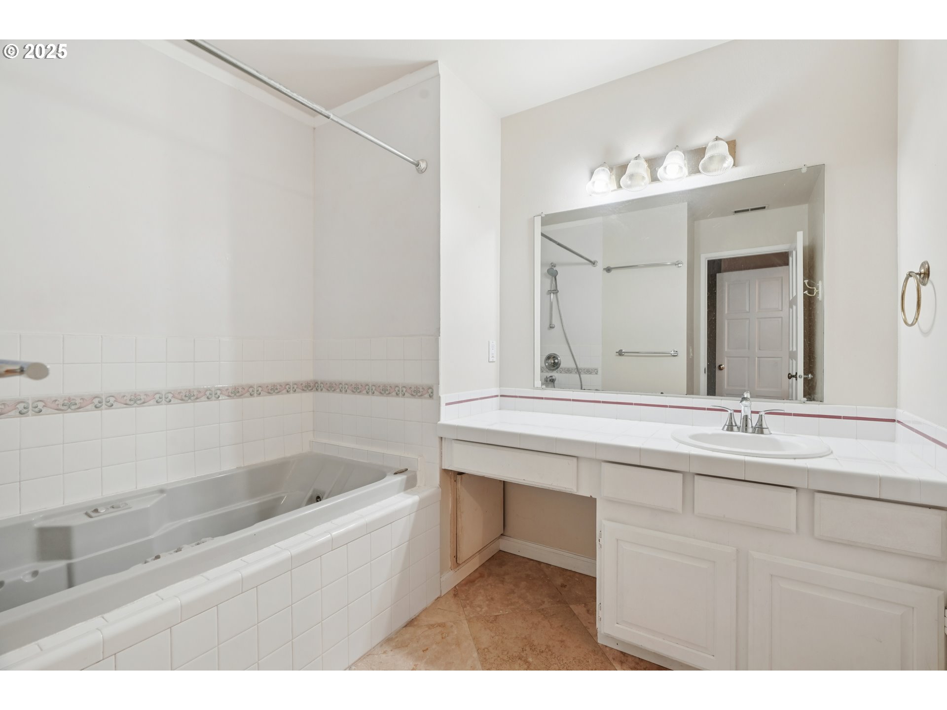 14678 Southwest 106th Avenue Tigard, OR 97224 - Photo 28 of 41 a bathroom with a bathtub and a sink