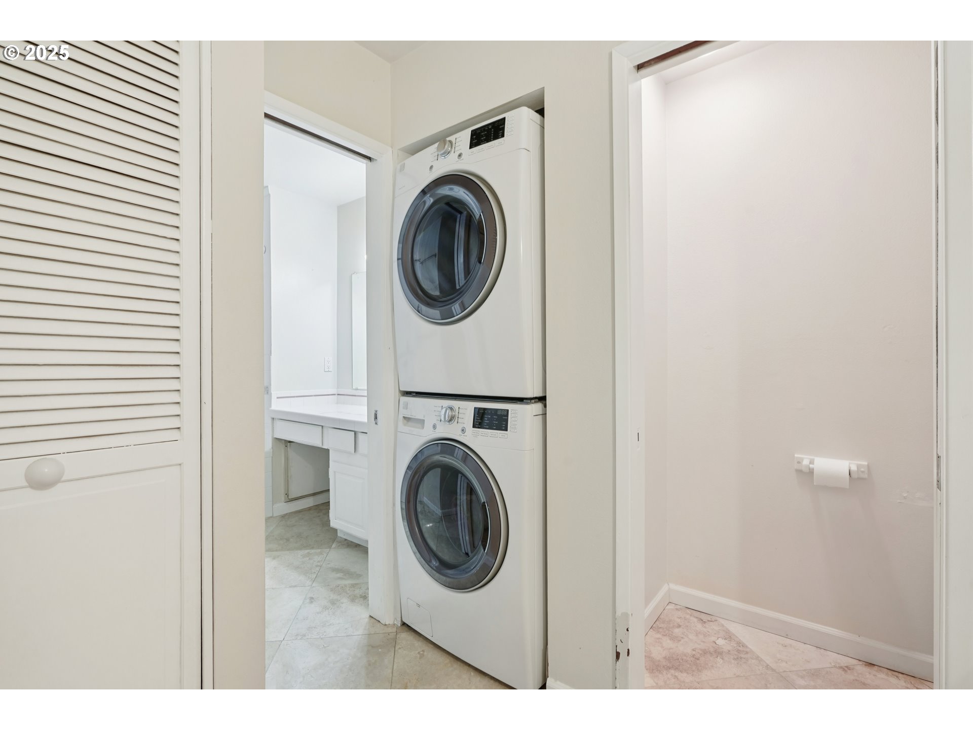 14678 Southwest 106th Avenue Tigard, OR 97224 - Photo 31 of 41 a view of a hallway with washer and dryer