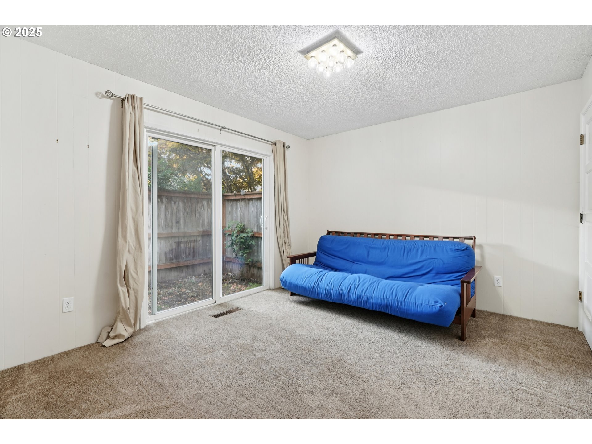 14678 Southwest 106th Avenue Tigard, OR 97224 - Photo 32 of 41 a room with a bed and a dresser