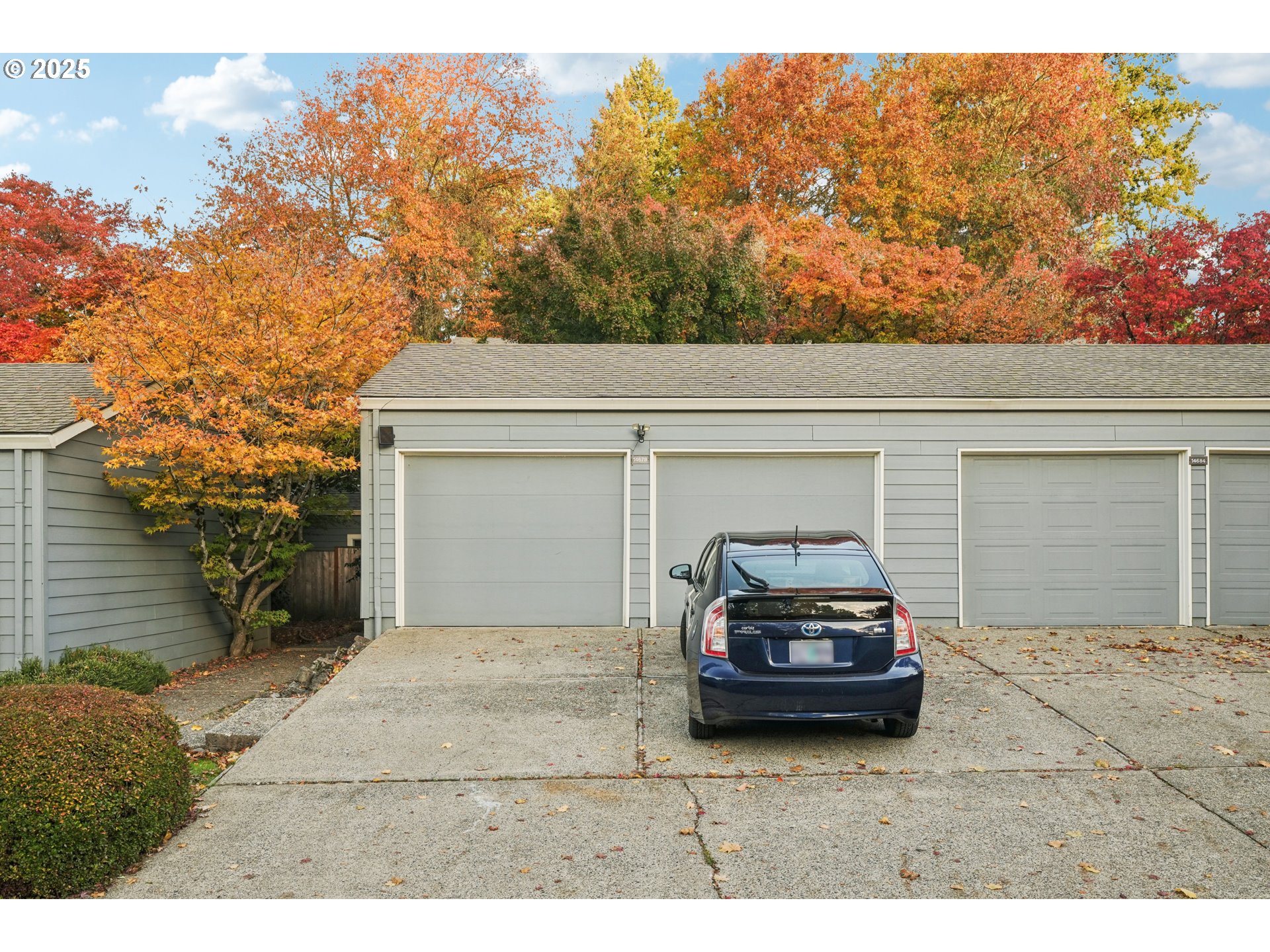 14678 Southwest 106th Avenue Tigard, OR 97224 - Photo 6 of 41 a car parked in front of a house