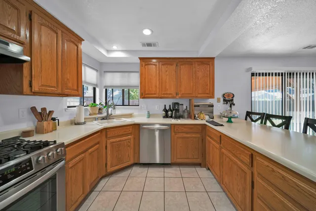 a kitchen with a sink and refrigerator
