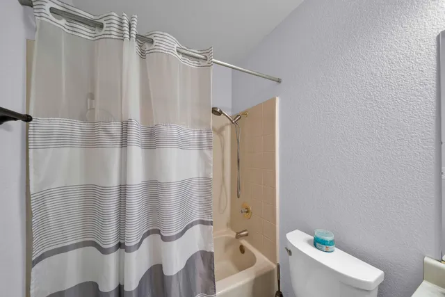 a bathroom with a sink vanity granite and a mirror