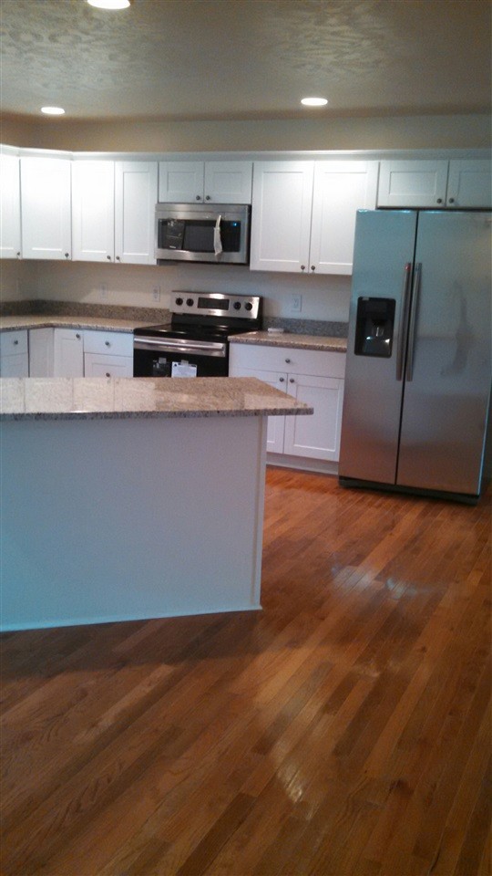 205 Rivers Edge Lane Benton, TN 37307 - Photo 8 of 19 a kitchen with stainless steel appliances a microwave a sink and a refrigerator