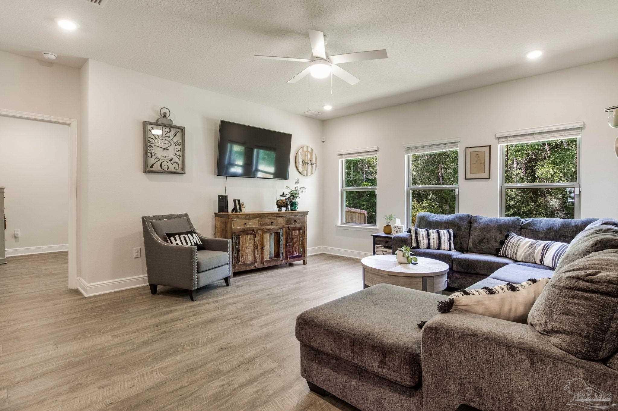 7990 Burnside Loop Pensacola, FL 32526 - Photo 16 of 61 a living room with furniture and a large window