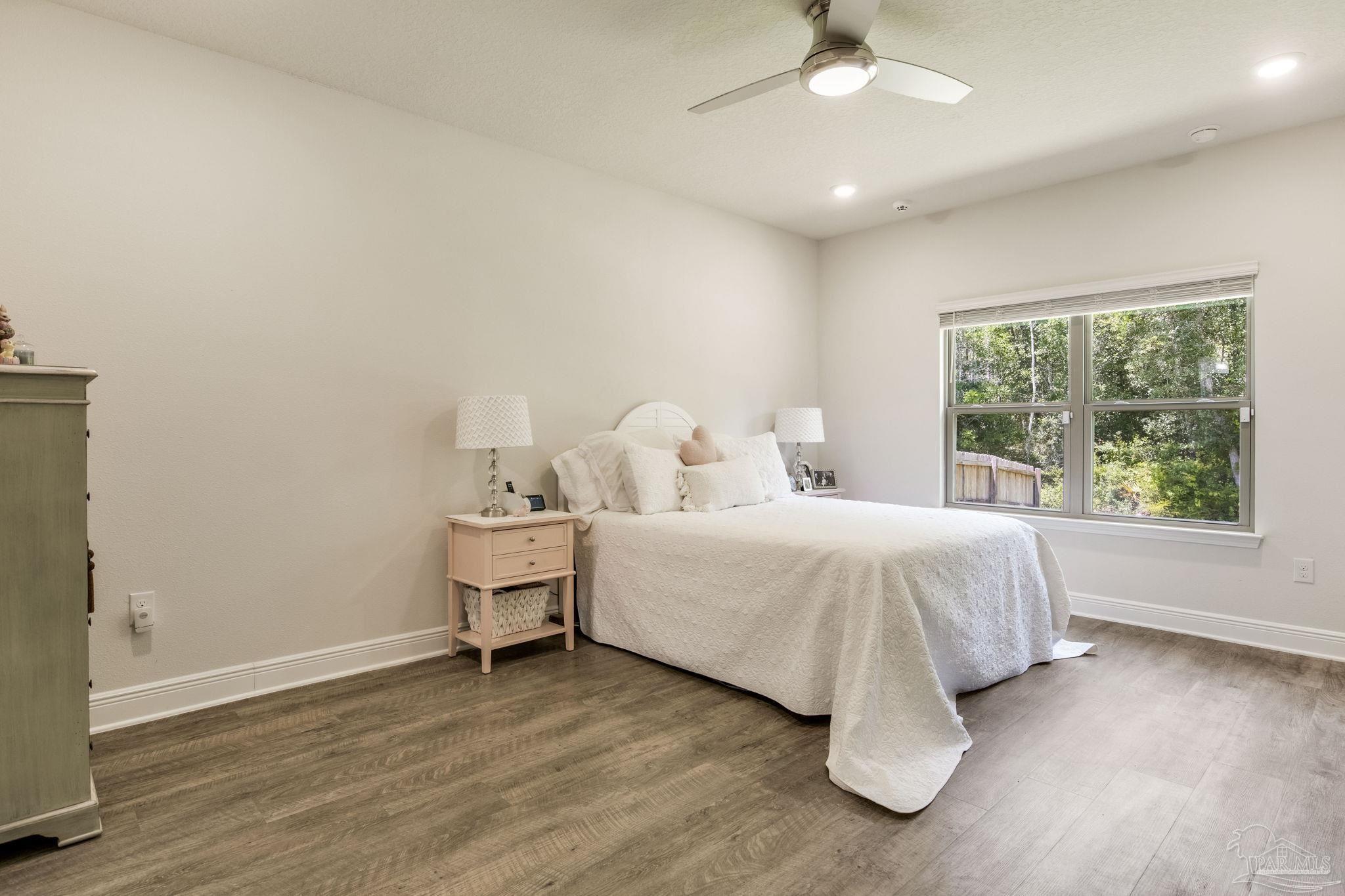 7990 Burnside Loop Pensacola, FL 32526 - Photo 23 of 61 a bedroom with a bed and window