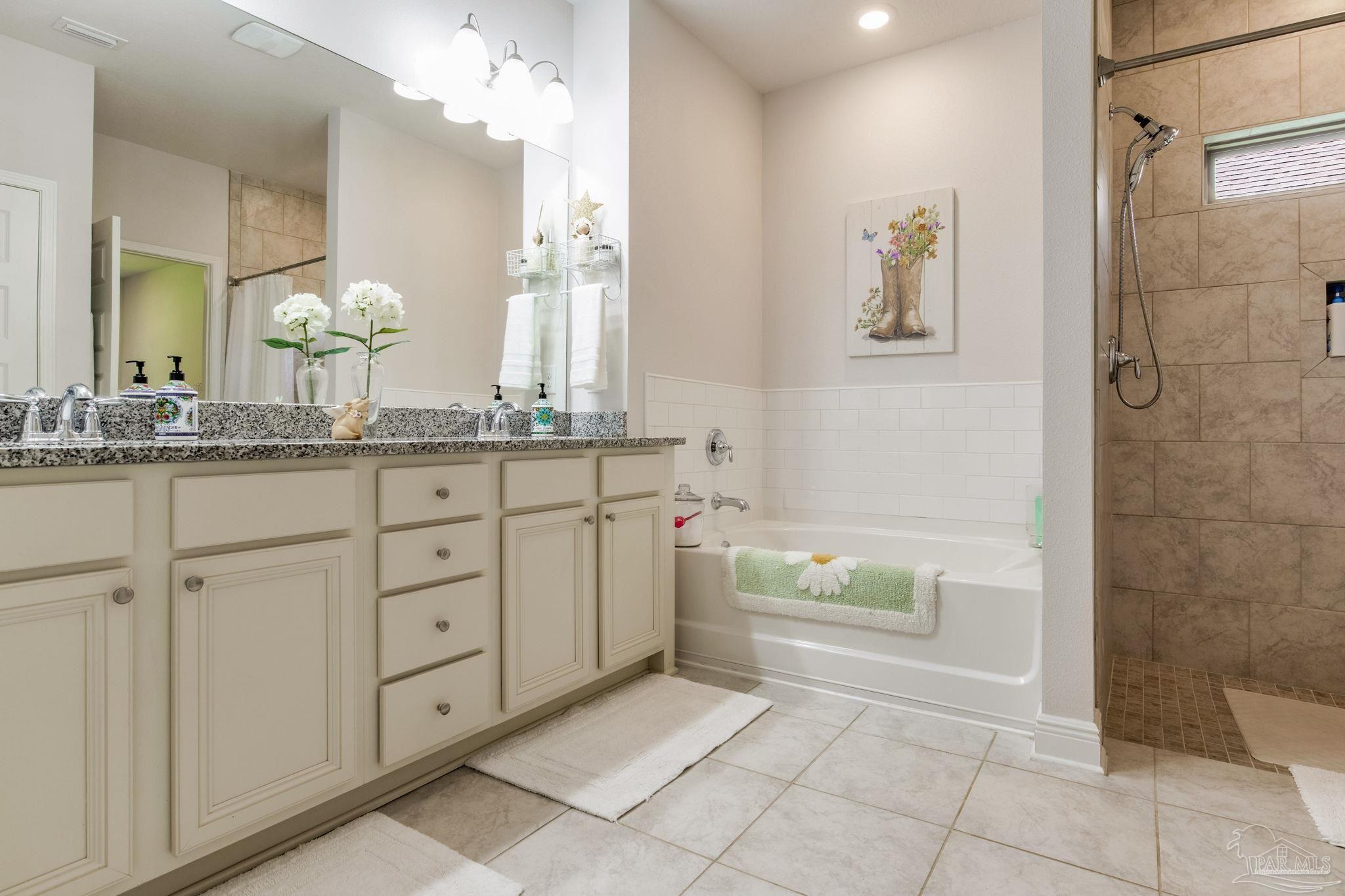 7990 Burnside Loop Pensacola, FL 32526 - Photo 27 of 61 a bathroom with a sink a toilet and bathtub