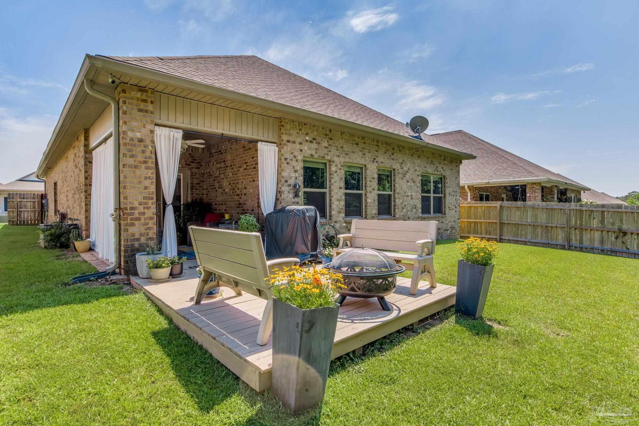 7990 Burnside Loop Pensacola, FL 32526 - Photo 44 of 61 a view of an house with backyard porch and furniture