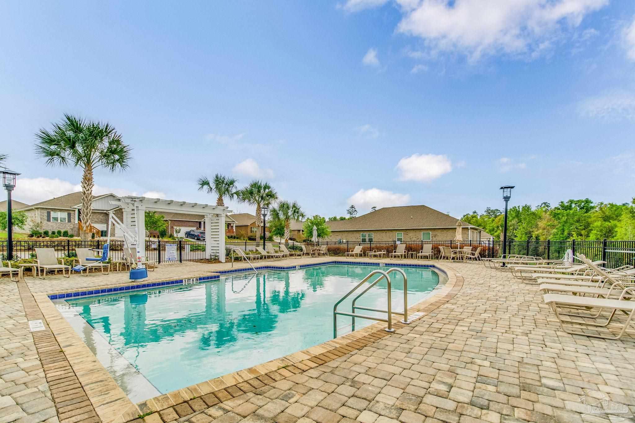 7990 Burnside Loop Pensacola, FL 32526 - Photo 57 of 61 a view of a swimming pool with a patio