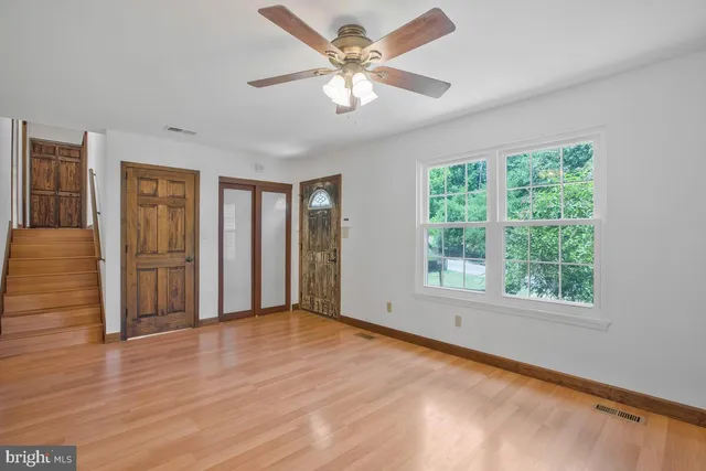 a view of an empty room with a window