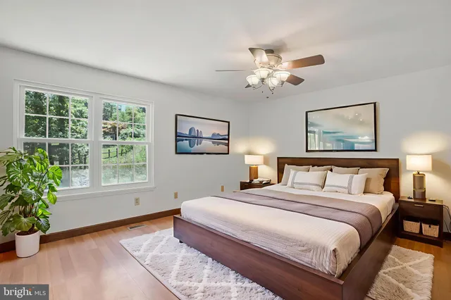 a bedroom with a large bed and a window