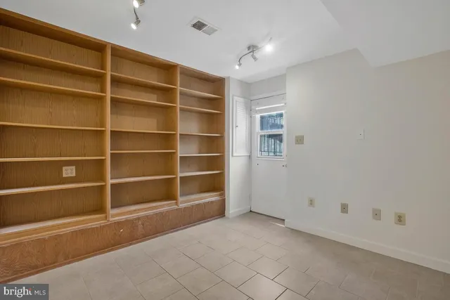 a view of an empty room with a empty shelves