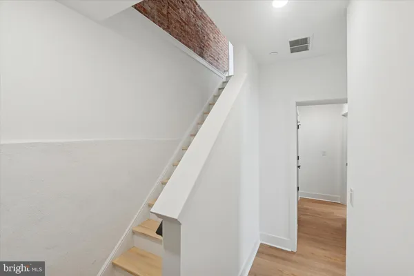 a view of entryway with wooden floor