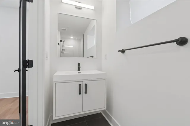 a bathroom with a sink and mirror