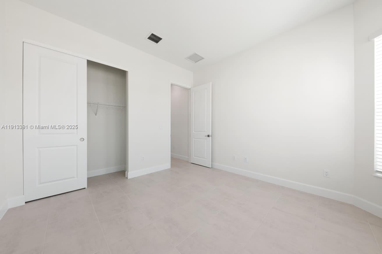 5786 Aleppo Pne Place Westlake, FL 33470 - Photo 19 of 30 a view of an empty room