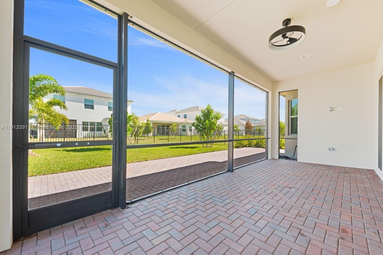 5786 Aleppo Pne Place Westlake, FL 33470 - Photo 28 of 30 a view of a room with wooden floor and windows
