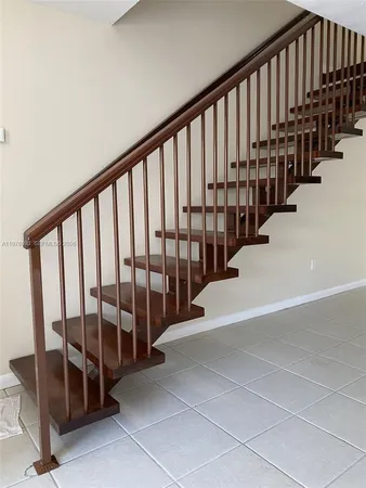 a view of staircase with lots of white walls
