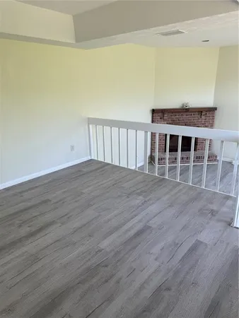 a view of wooden floor and staircase in a room