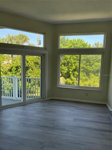 a view of a house with a wooden deck