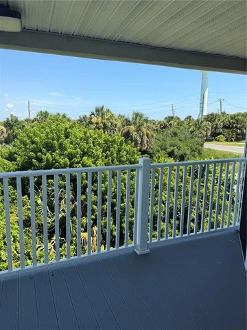 a white toilet sitting next to a bath tub