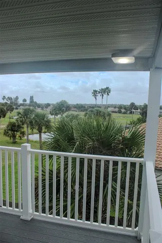 a view of a swimming pool and a chairs