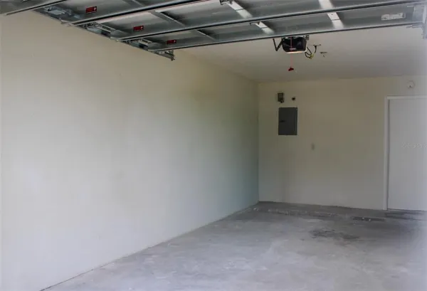 a small white building with a white roof