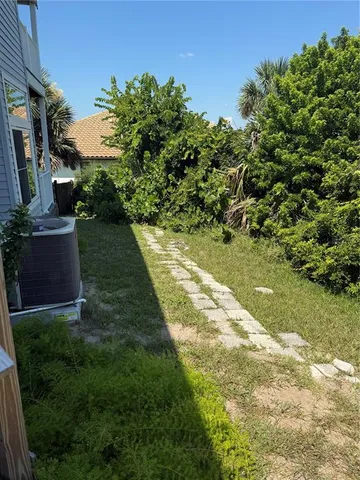 a kitchen with stainless steel appliances a refrigerator stove and cabinets