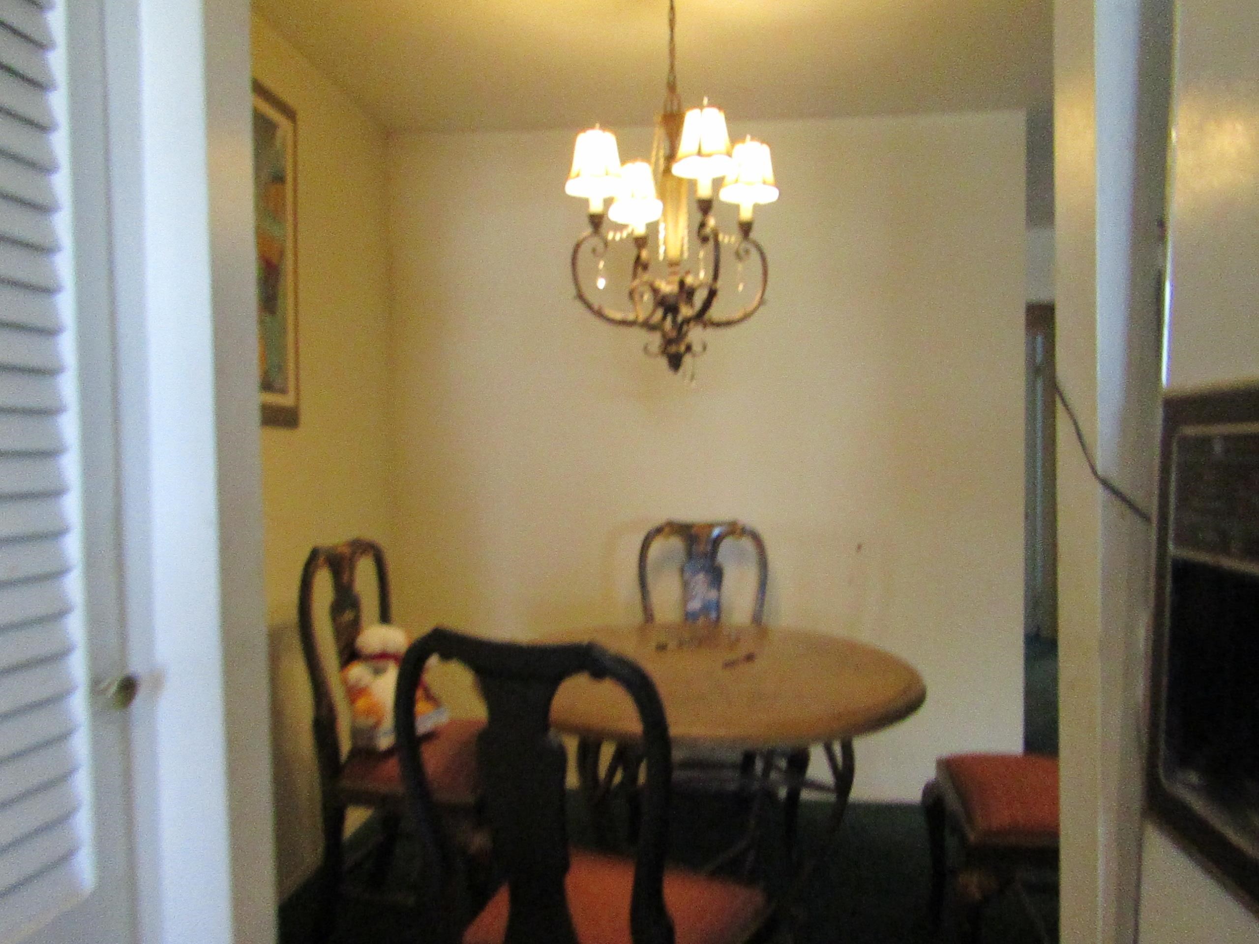 31 Exeter Road Jersey City, NJ 07305 - Photo 13 of 39 a view of a dining room with furniture and chandelier