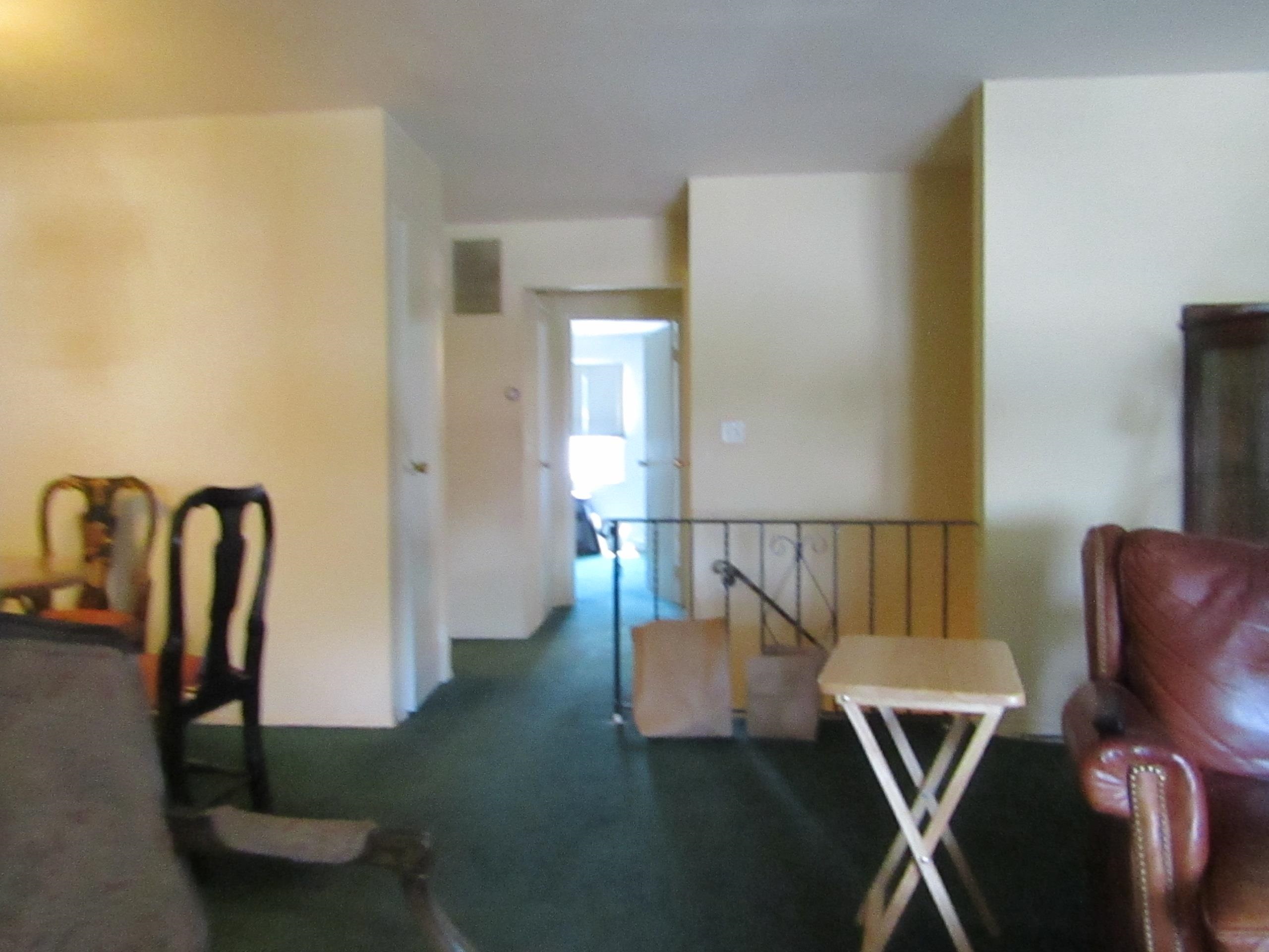 31 Exeter Road Jersey City, NJ 07305 - Photo 18 of 39 a view of a dining room with furniture a kitchen and wooden floor