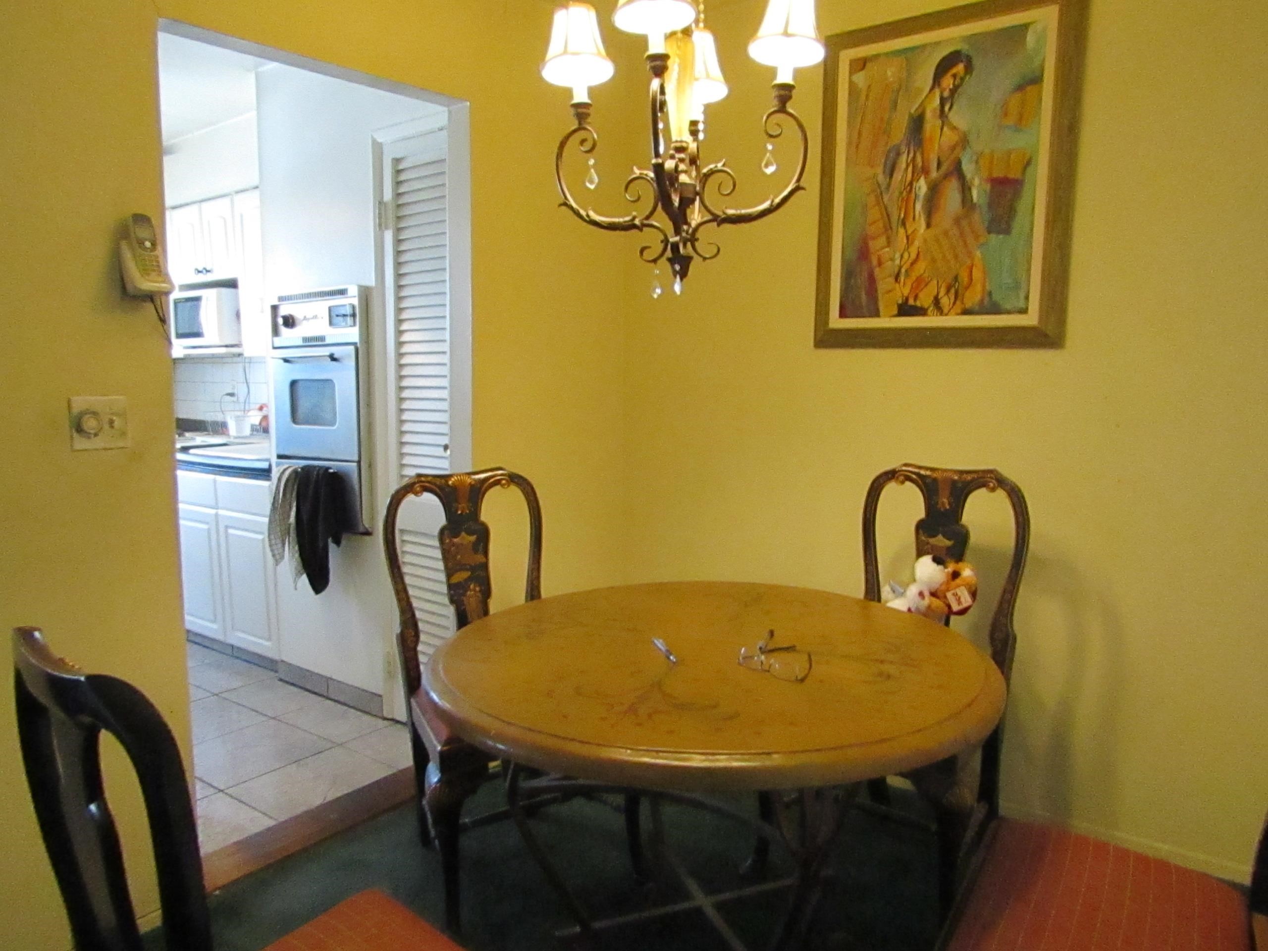 31 Exeter Road Jersey City, NJ 07305 - Photo 9 of 39 a close view of a sink a table and chairs